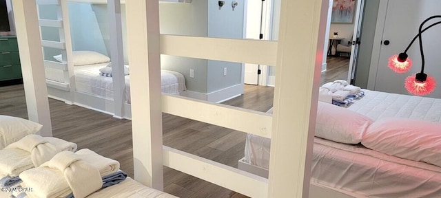 bedroom with dark hardwood / wood-style floors