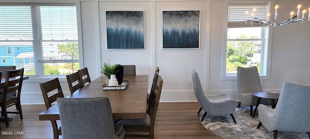 dining space featuring a chandelier, dark hardwood / wood-style floors, and a wealth of natural light