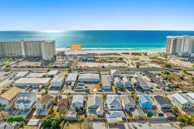 bird's eye view with a water view and a view of the beach