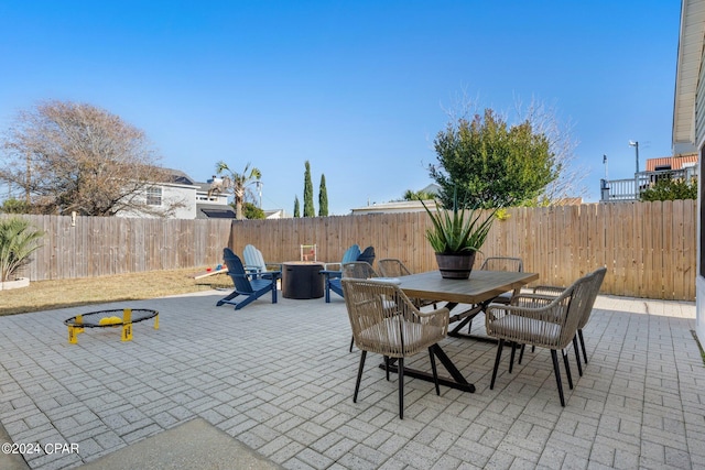 view of patio with an outdoor fire pit