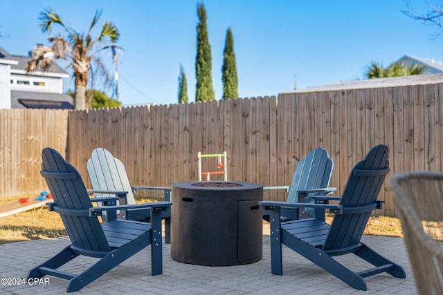 view of patio / terrace with a fire pit