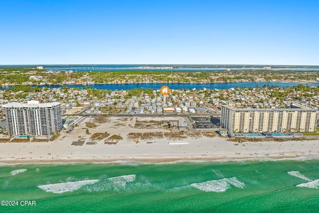 birds eye view of property with a view of the beach and a water view