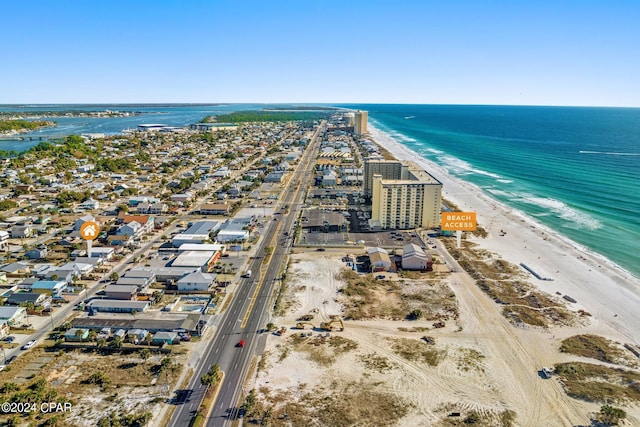 birds eye view of property featuring a view of the beach and a water view