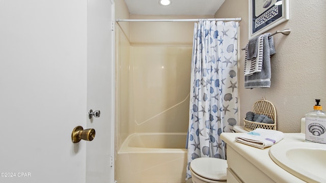 full bathroom featuring toilet, vanity, and shower / tub combo with curtain