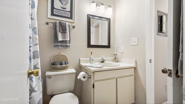 bathroom featuring toilet and vanity