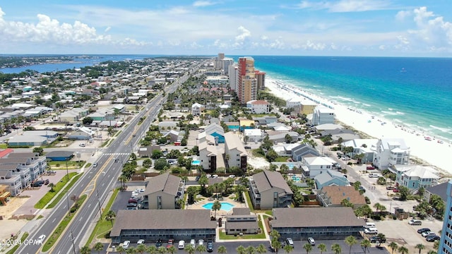 birds eye view of property featuring a beach view and a water view