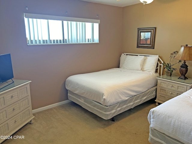 bedroom with light colored carpet