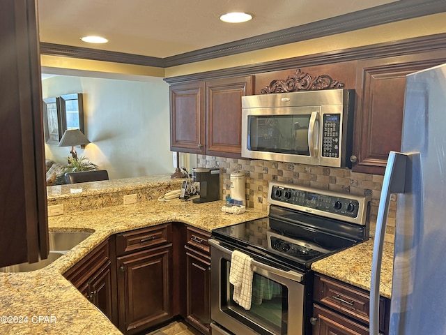 kitchen featuring appliances with stainless steel finishes, backsplash, ornamental molding, light stone countertops, and dark brown cabinets