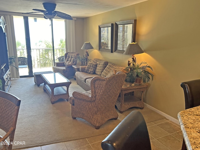 living room featuring tile patterned floors, floor to ceiling windows, and ceiling fan