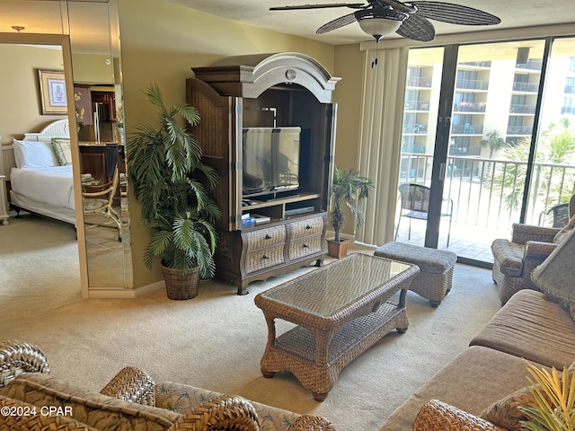 carpeted living room featuring ceiling fan