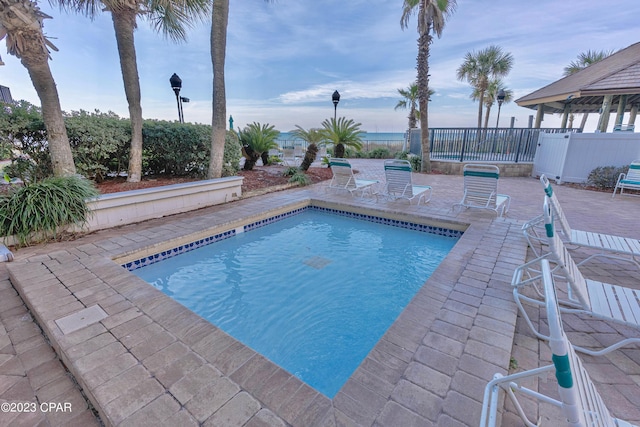 view of swimming pool with a gazebo and a patio area