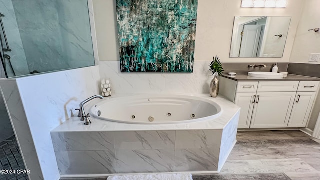 bathroom featuring oversized vanity and hardwood / wood-style flooring