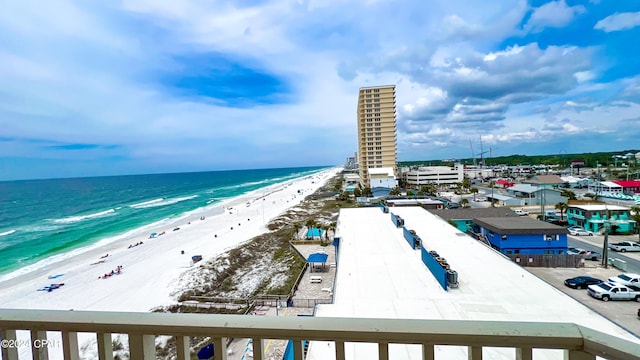 drone / aerial view with a beach view and a water view