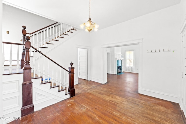 entrance foyer featuring a chandelier and dark hardwood / wood-style flooring