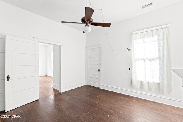 unfurnished room with dark hardwood / wood-style floors and ceiling fan