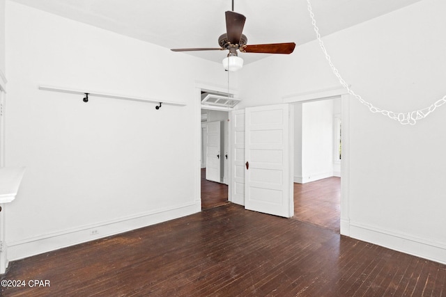 unfurnished room with dark hardwood / wood-style flooring and ceiling fan