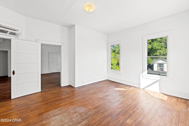 empty room featuring dark hardwood / wood-style flooring