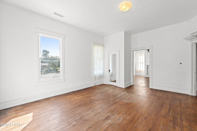 empty room featuring dark hardwood / wood-style floors