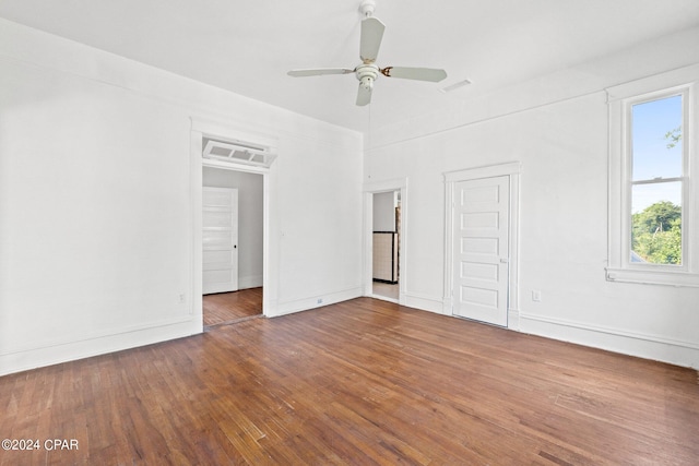 unfurnished room featuring ceiling fan and dark hardwood / wood-style flooring