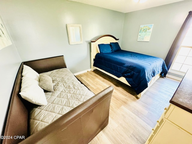 bedroom featuring hardwood / wood-style flooring