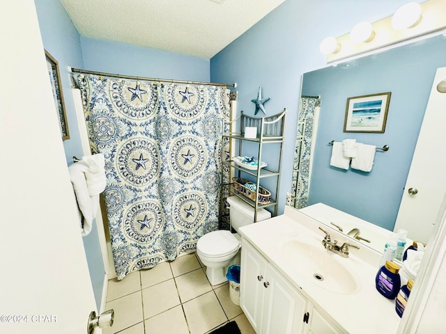 bathroom featuring a textured ceiling, vanity, toilet, and tile flooring