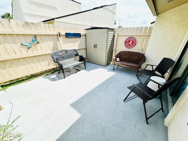 view of patio / terrace featuring a shed