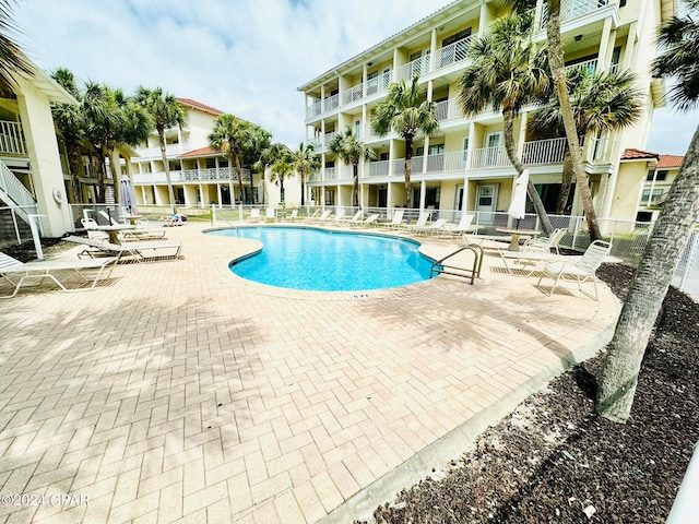 view of swimming pool featuring a patio