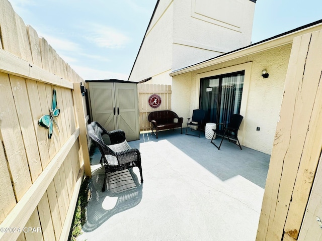 view of terrace with a storage unit