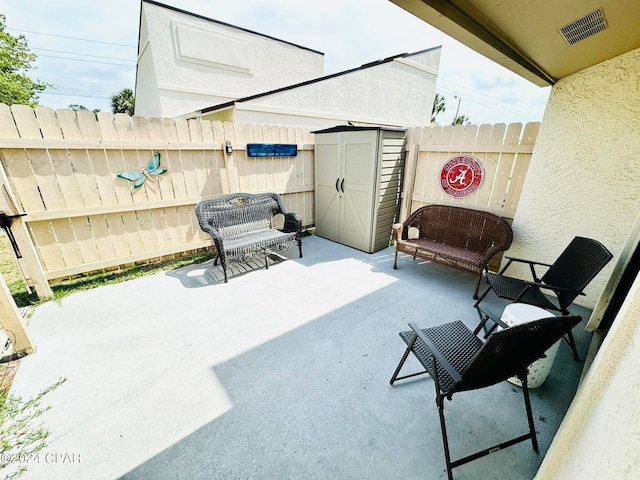 view of terrace with a shed