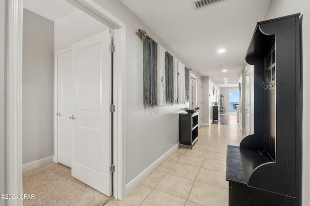 hallway featuring light tile flooring