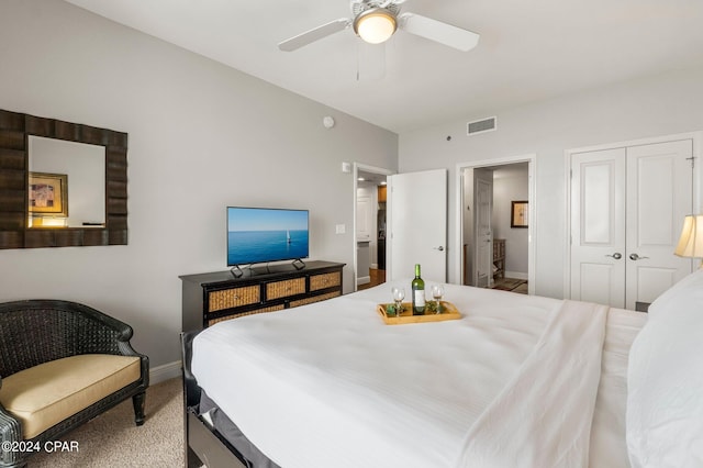 bedroom with wood-type flooring, connected bathroom, and a closet