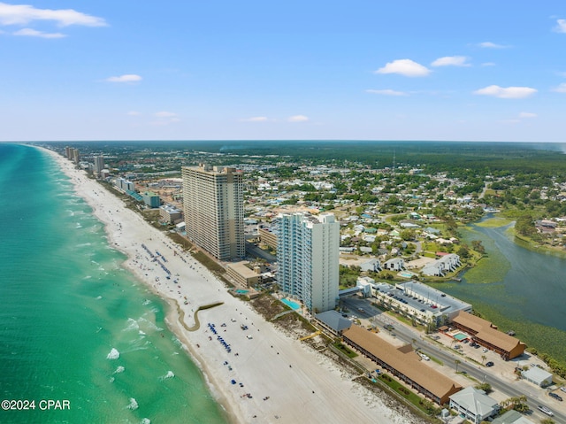 bird's eye view featuring a water view and a view of the beach