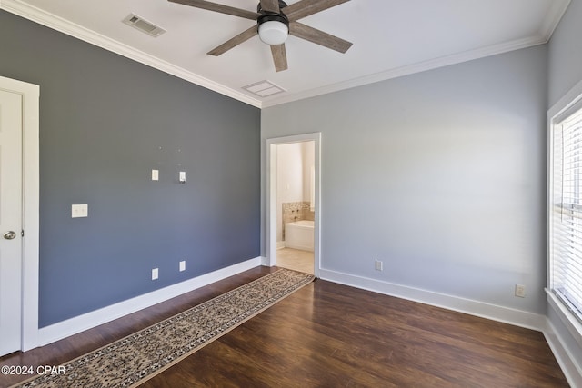 spare room featuring crown molding, dark hardwood / wood-style floors, and ceiling fan