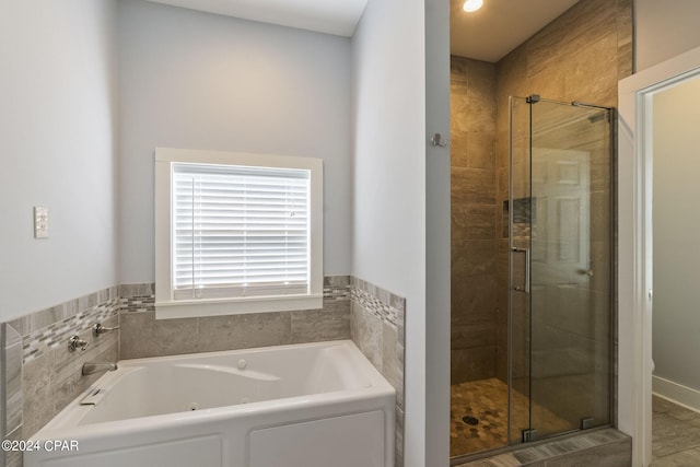 bathroom with shower with separate bathtub