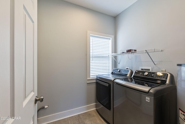 washroom with separate washer and dryer