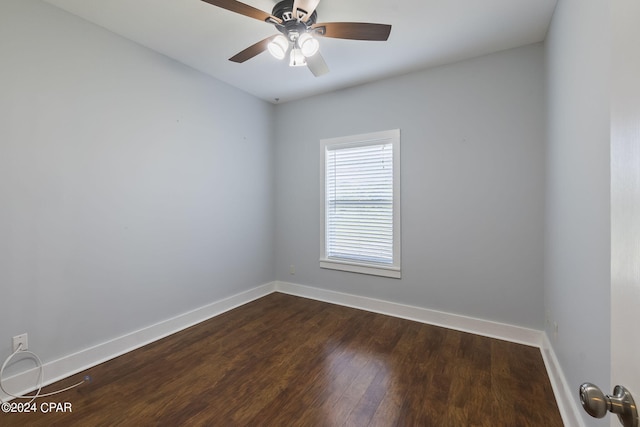 empty room featuring dark hardwood / wood-style floors and ceiling fan