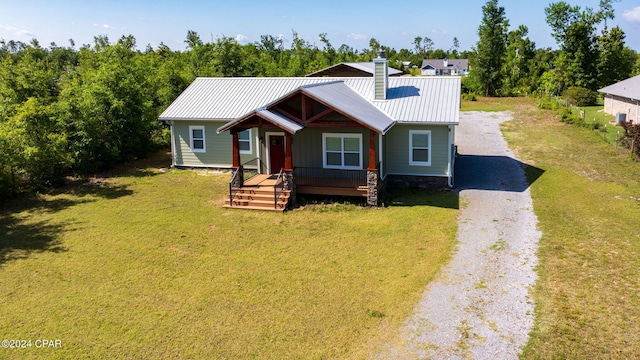 view of front of house featuring a front yard and covered porch