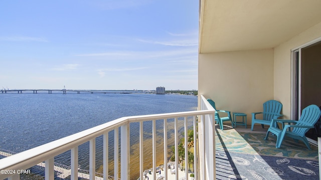 balcony featuring a water view