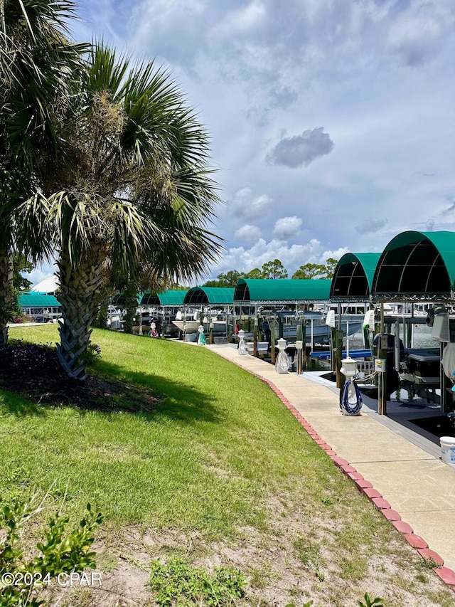 dock area featuring a lawn