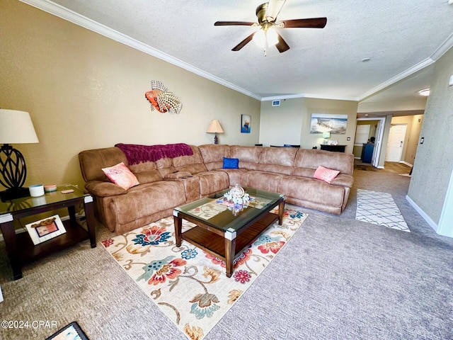 carpeted living room featuring ceiling fan, ornamental molding, and a textured ceiling