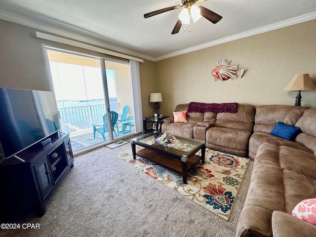 carpeted living room with crown molding, ceiling fan, and a textured ceiling