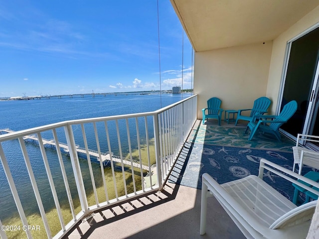 balcony featuring a water view