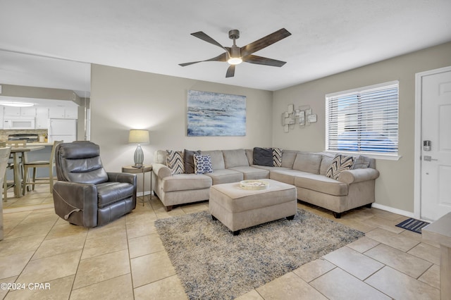 tiled living room featuring ceiling fan