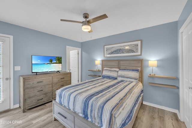 bedroom featuring light hardwood / wood-style floors and ceiling fan