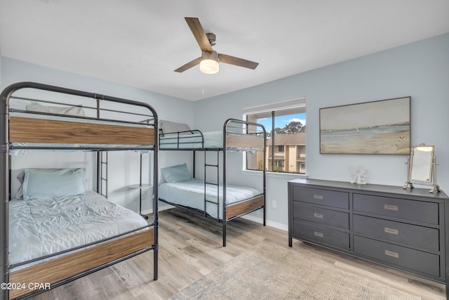 bedroom with ceiling fan and light wood-type flooring