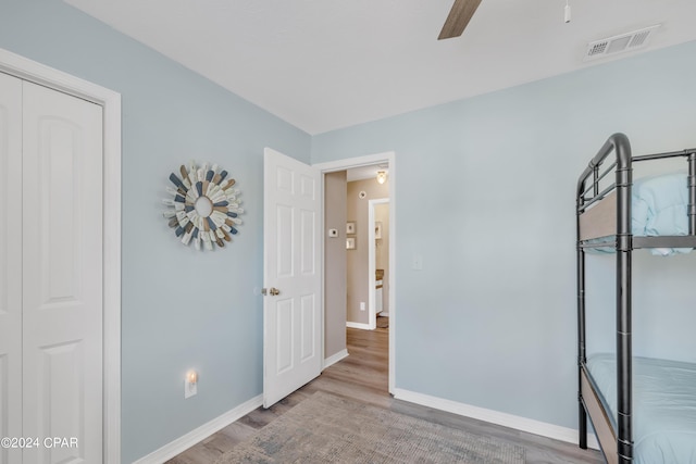 unfurnished bedroom with hardwood / wood-style flooring and ceiling fan