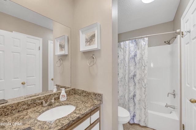 full bathroom with shower / bath combo, vanity, and toilet