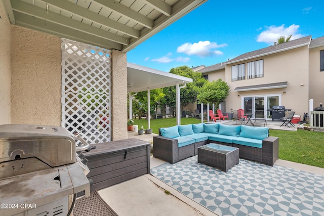 view of patio / terrace with an outdoor living space and a grill