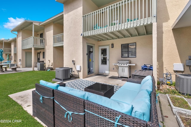 view of patio / terrace with an outdoor living space, area for grilling, and cooling unit