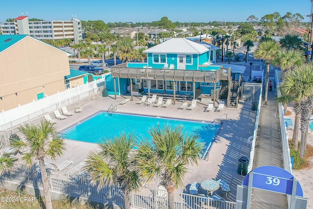 view of swimming pool with a patio